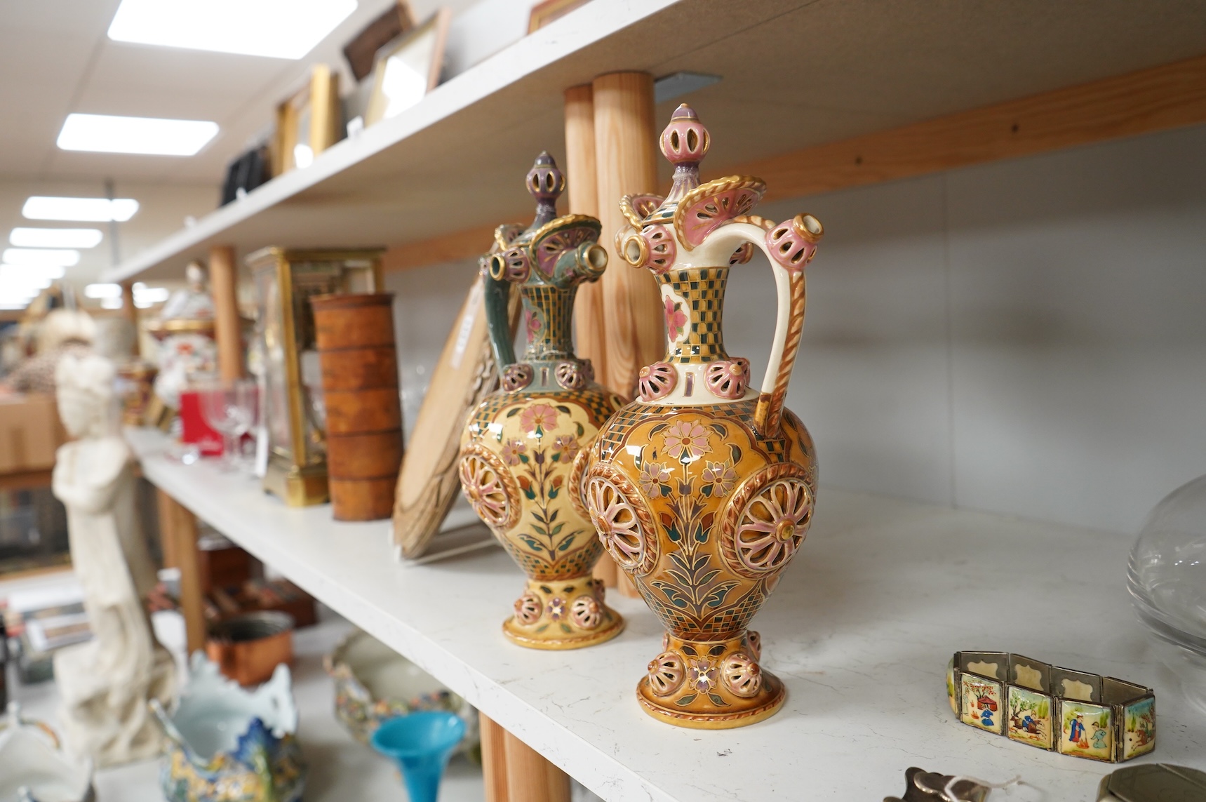 Two Zsolnay Persian inspired jugs / ewers and covers, stamped to the bases 29cm high